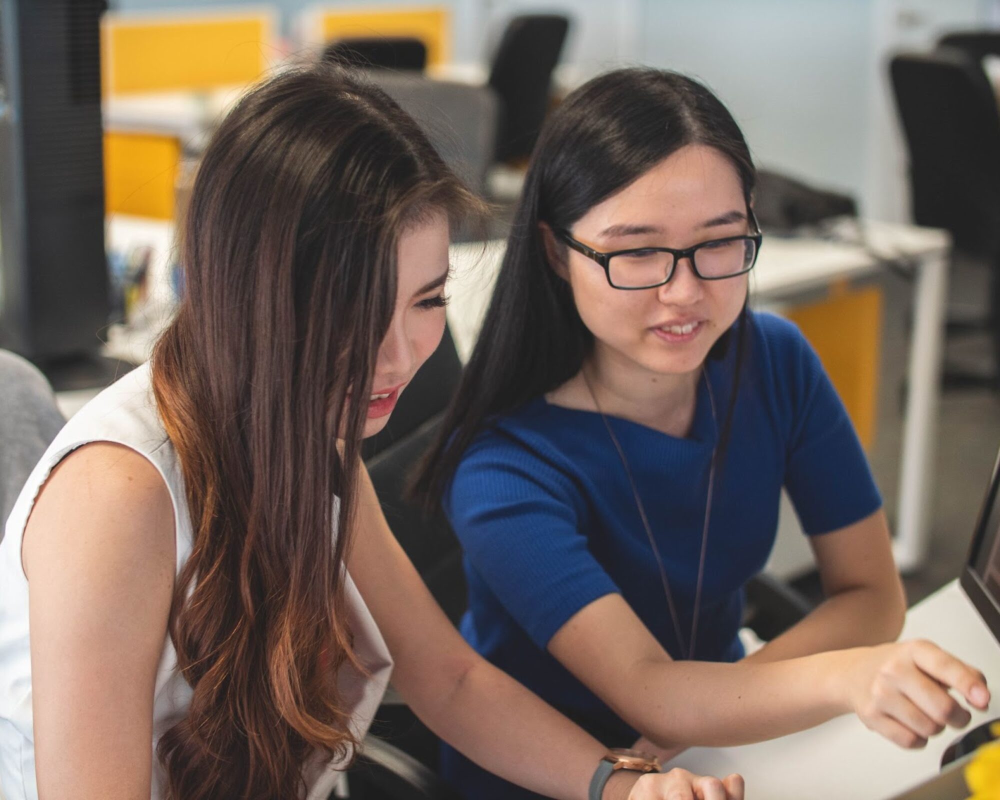 Two employees collaborating on a project.