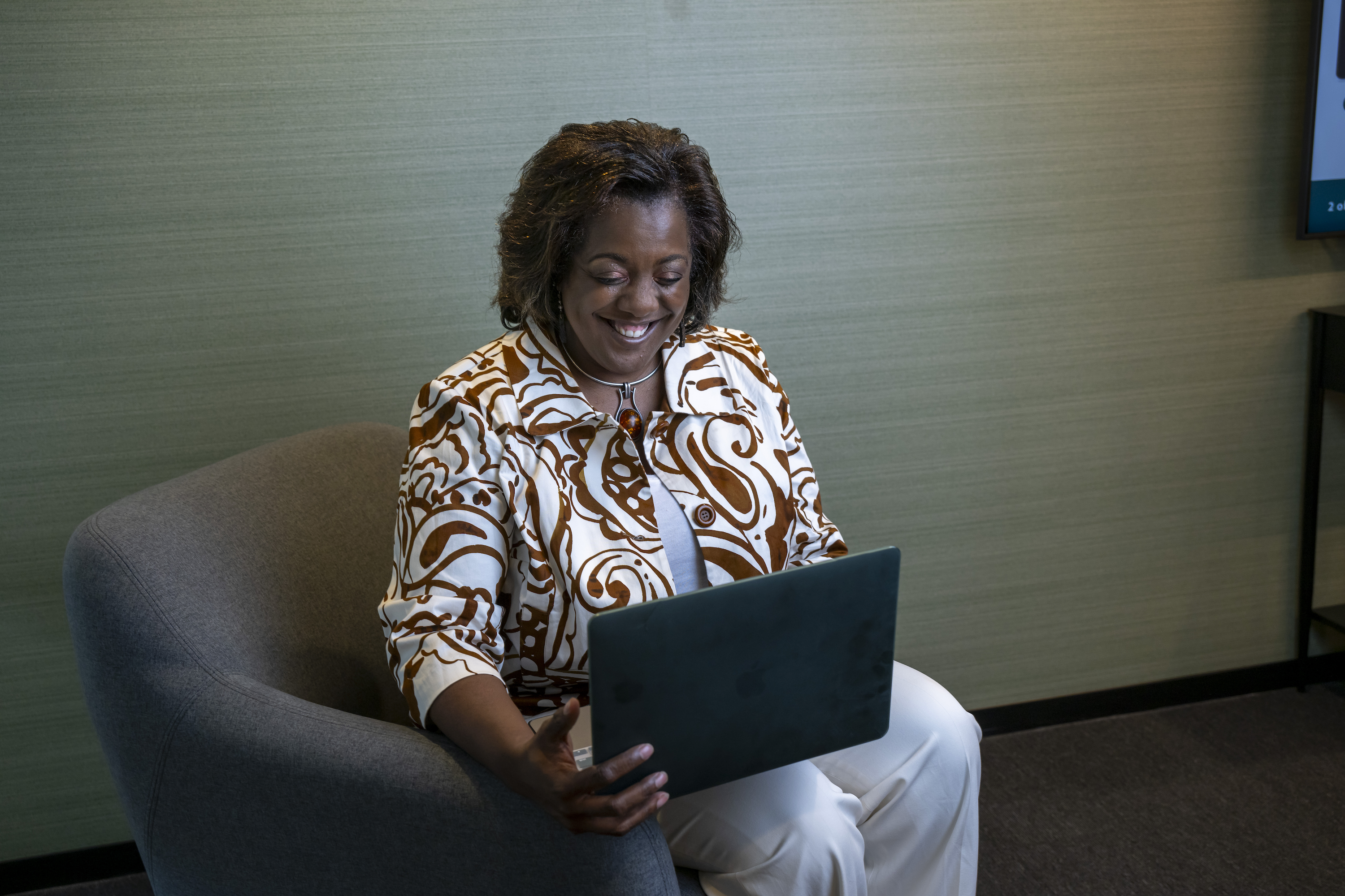 A Merit America learner working confidently on a laptop