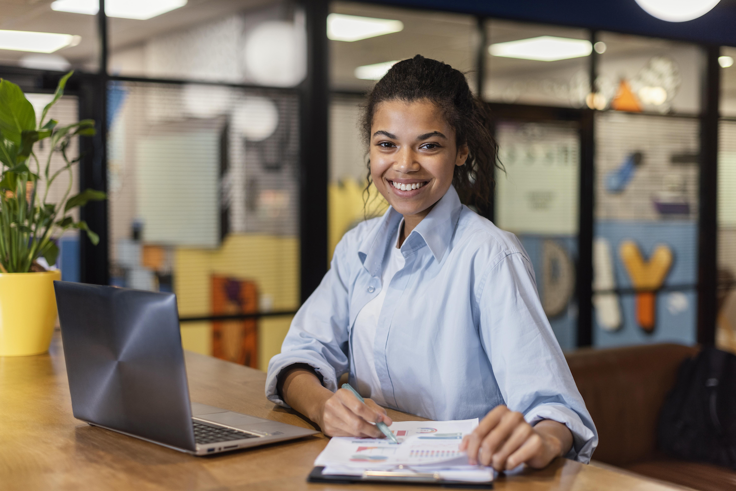 Merit America learner working on a laptop