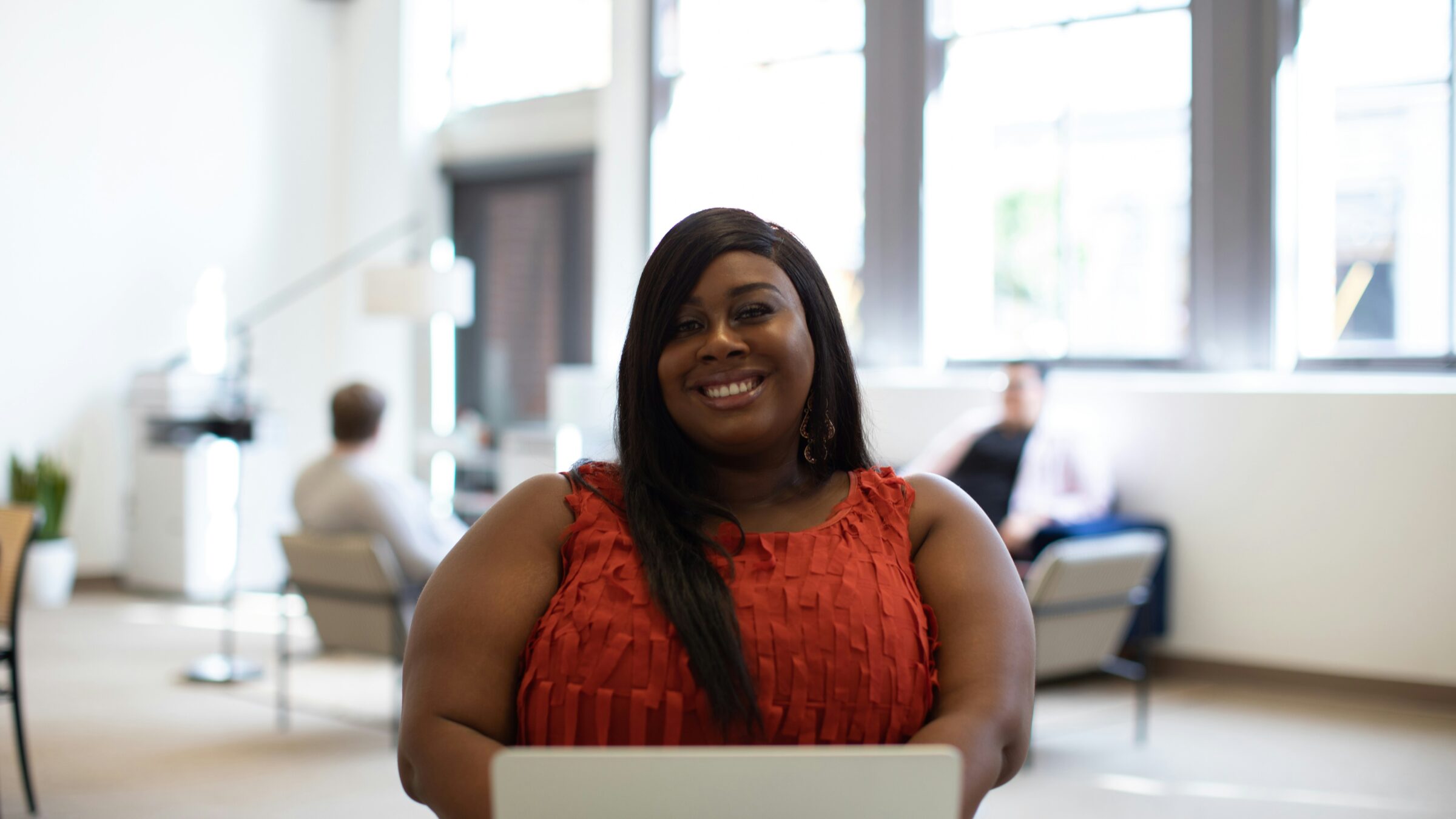 A photo of a woman smiling.