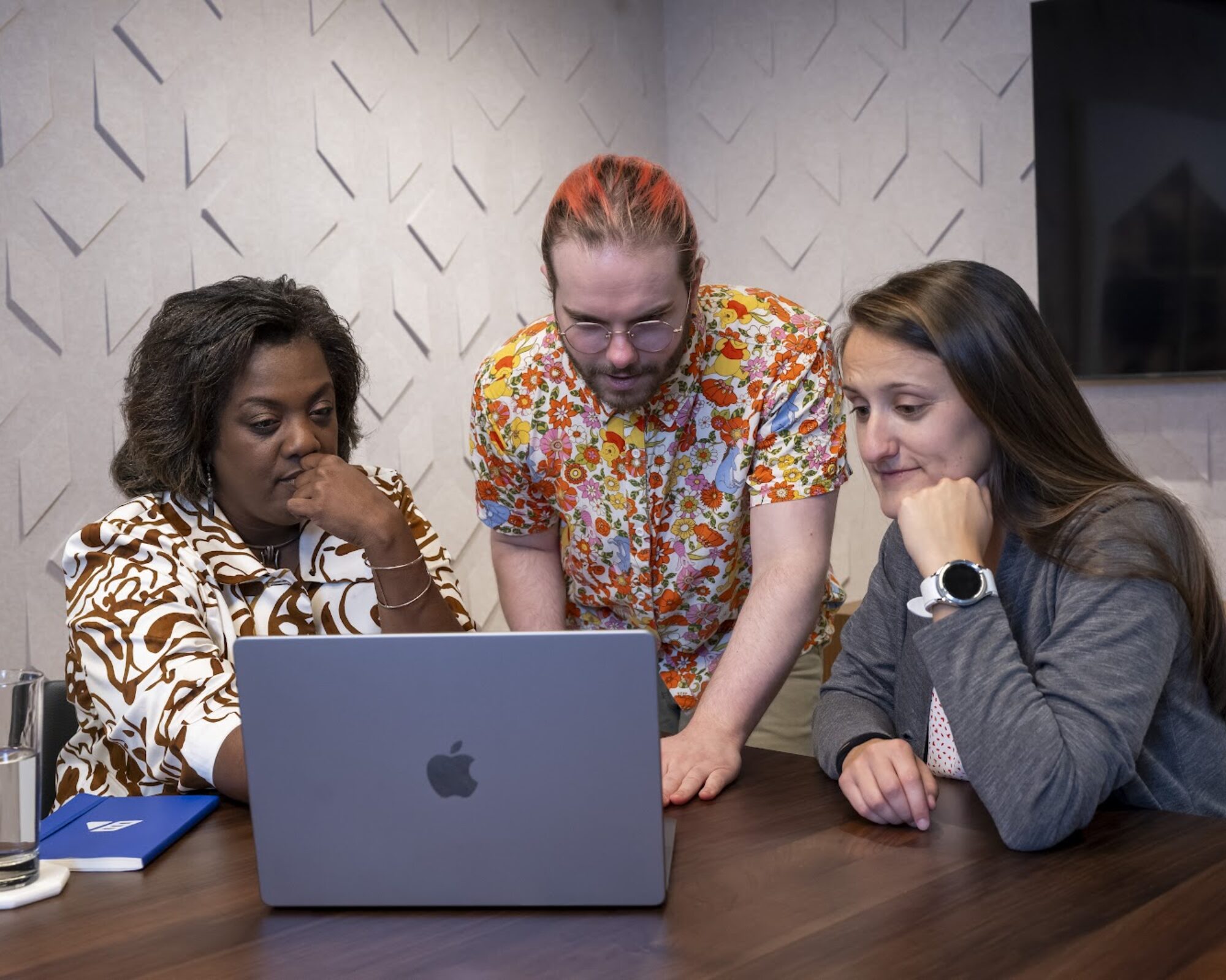 Three Merit America learners studying.