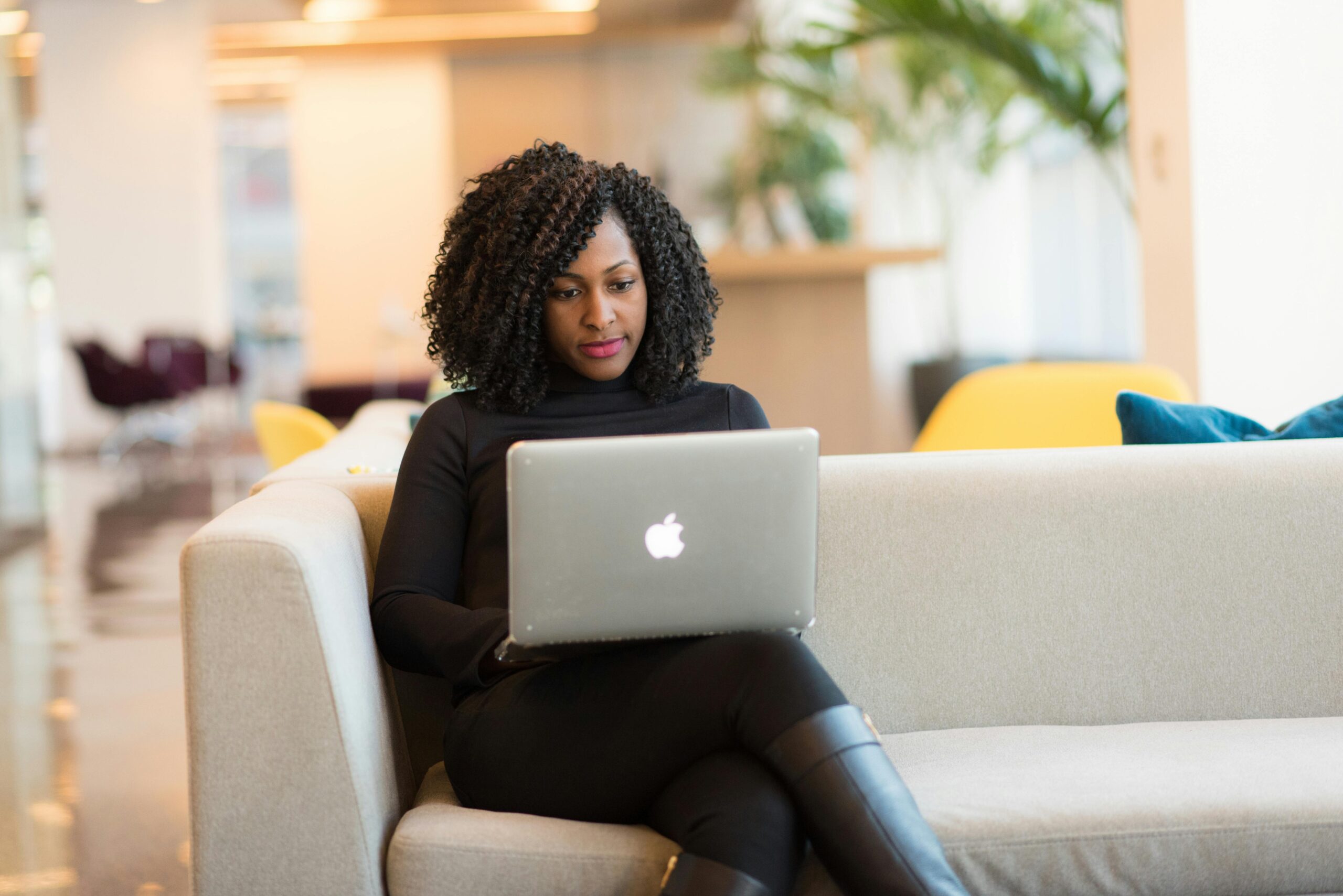 A woman looking at her laptop.