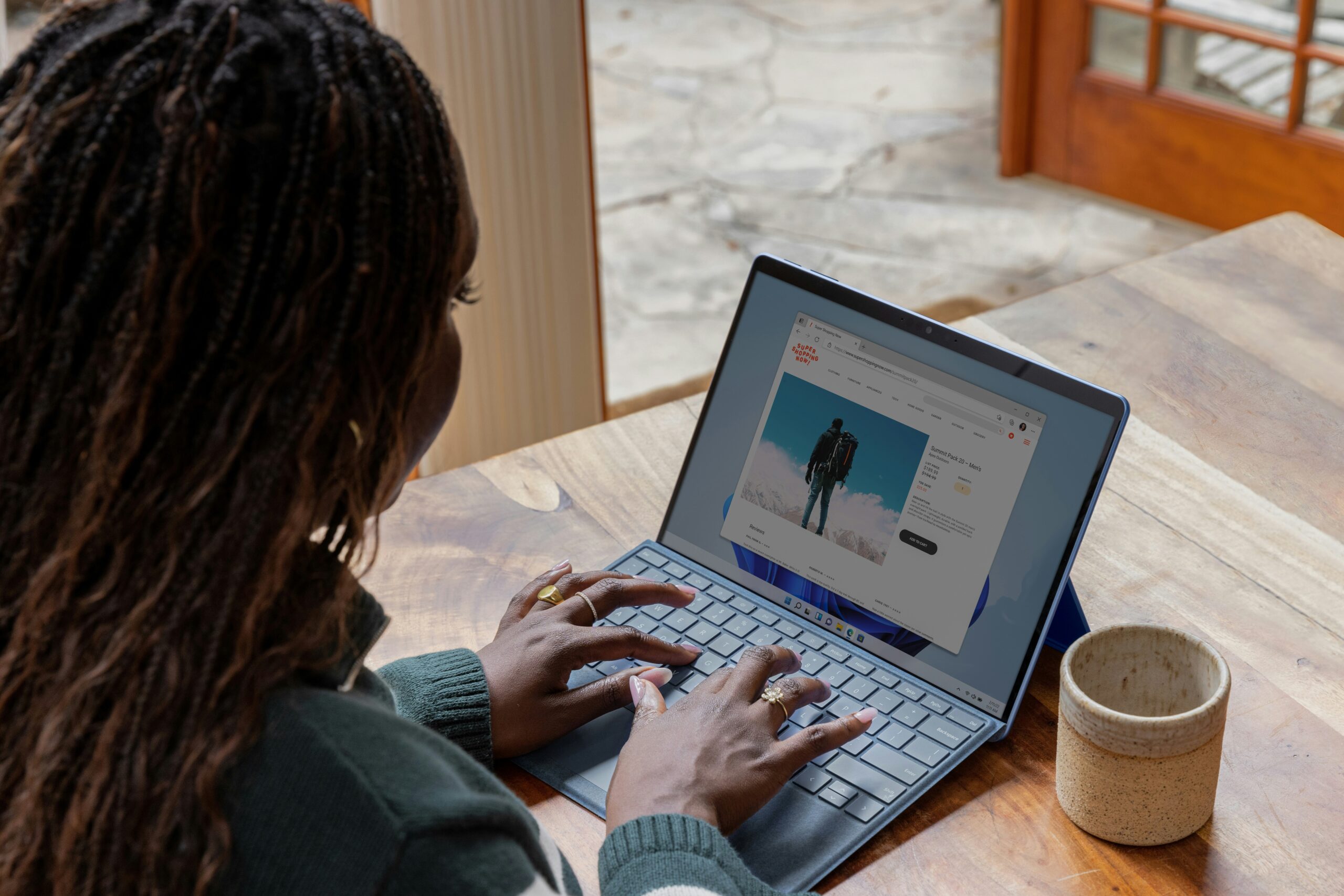 A photo of a person working on a laptop