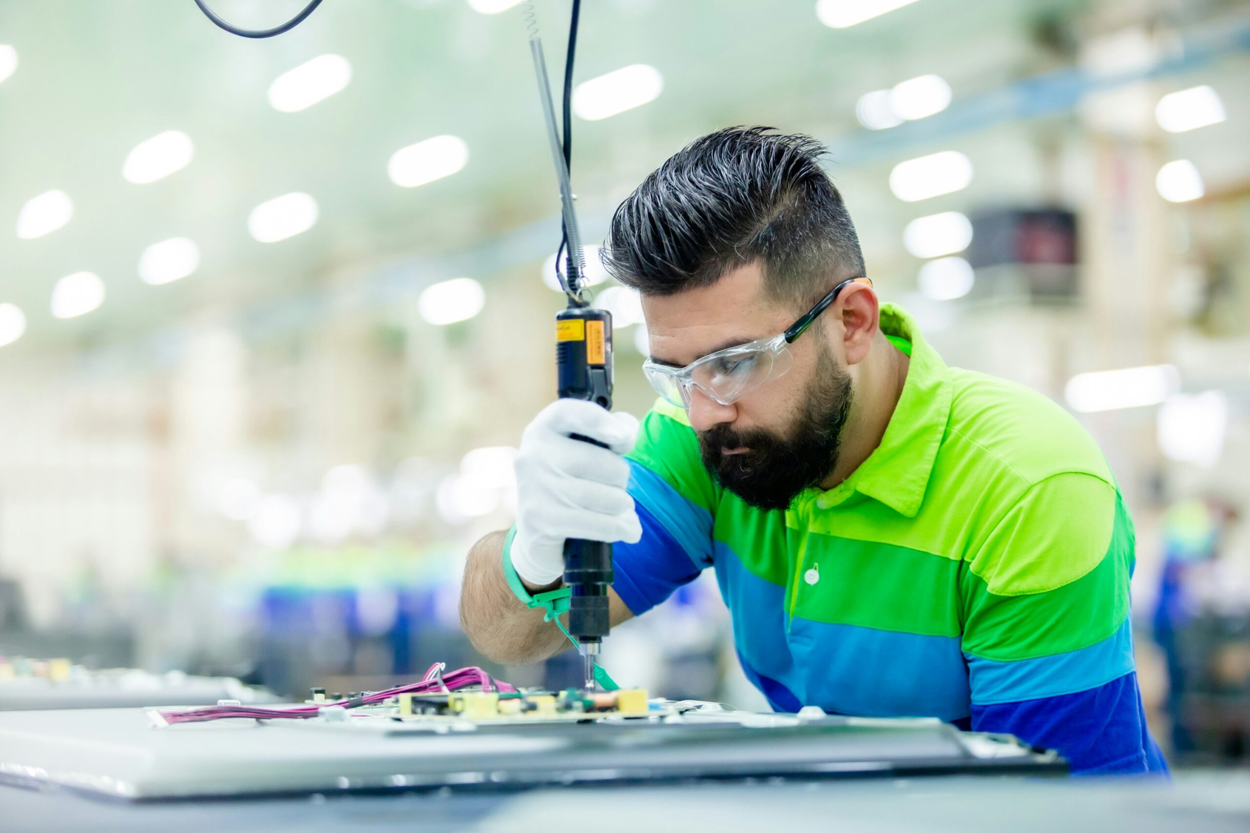A man manufacturing a semiconductor.