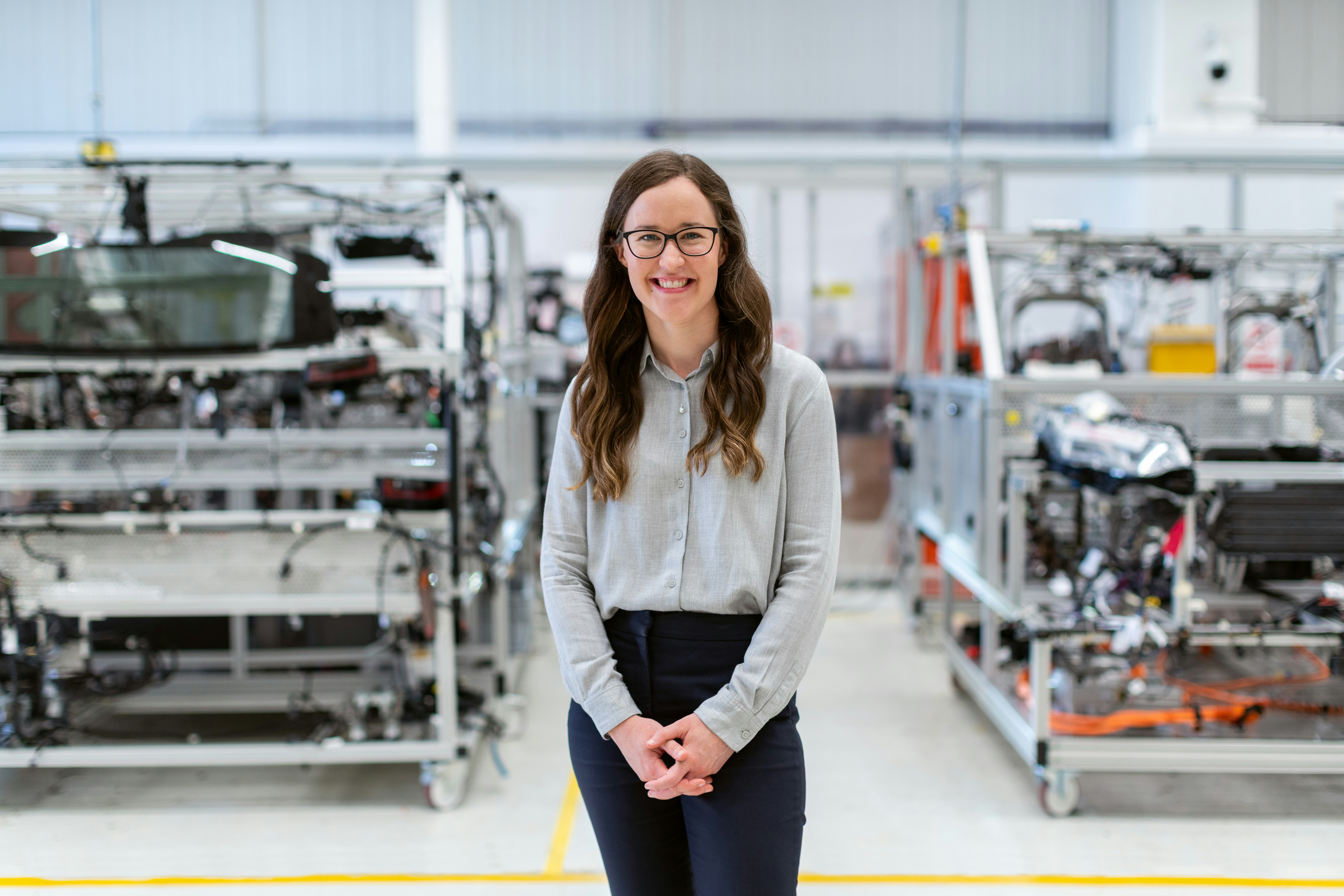 A woman standing in front of a lab.