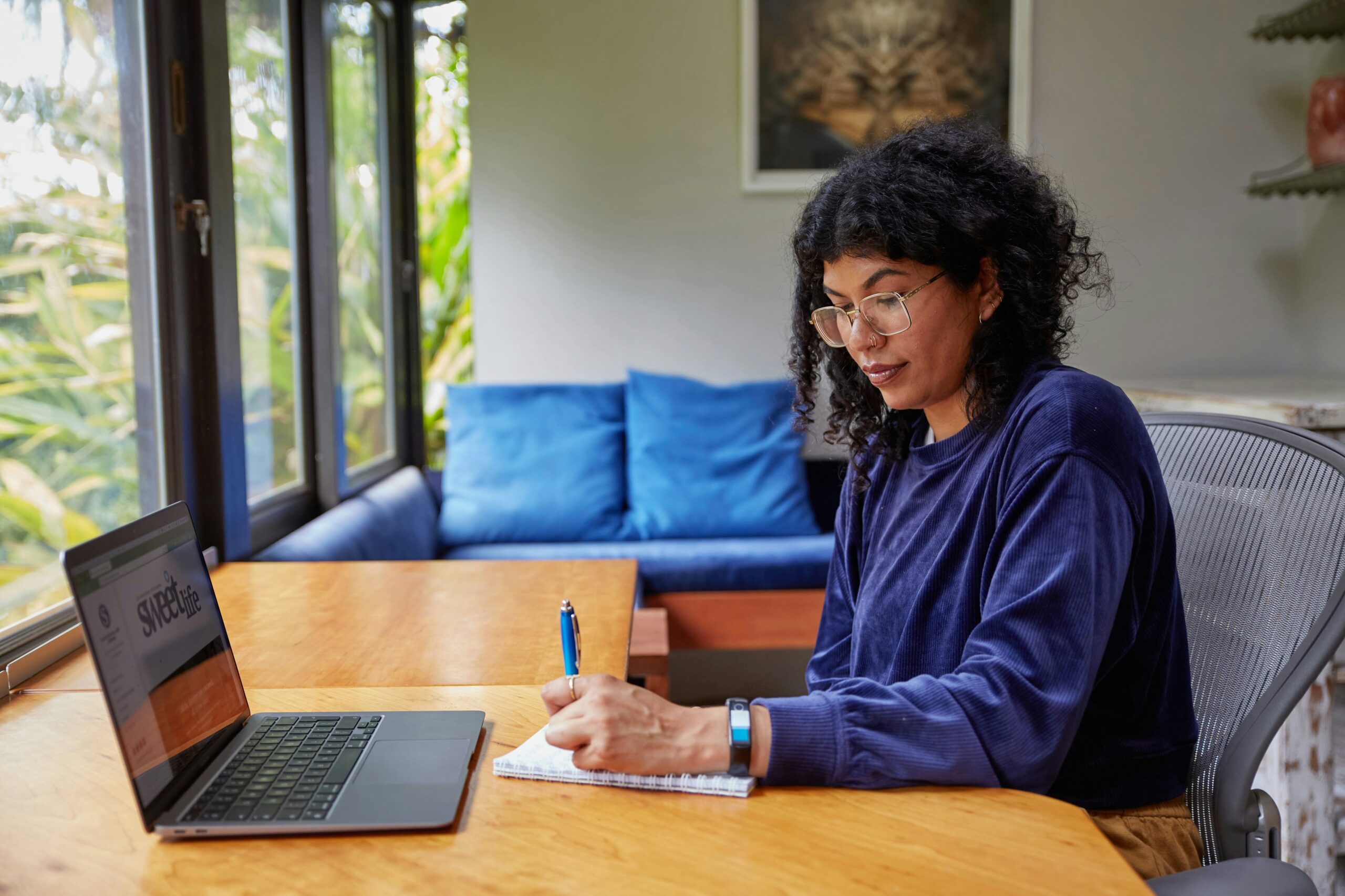 A woman at a laptop.